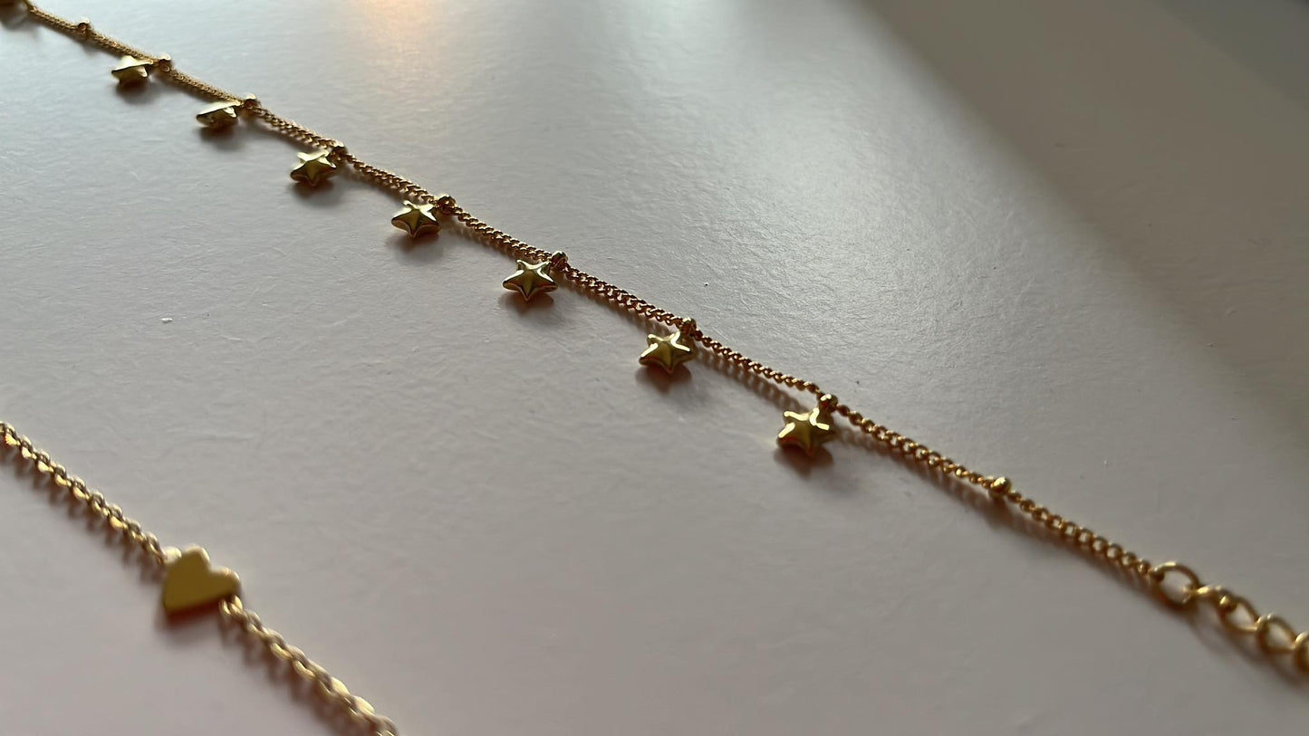 Armbandje met mini STERREN β goudkleurig RVS